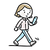 歩きながらスマートフォンを操作する女性のイラスト