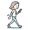 歩きながらスマートフォンを見て笑顔の女性のイラスト