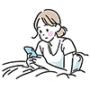 ベッドに横になってスマートフォンを操作する女性のイラスト