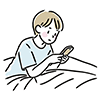 ベッドに横になってスマートフォンを操作する男性のイラスト