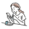カフェで食事をしながらスマートフォンを操作する女性のイラスト